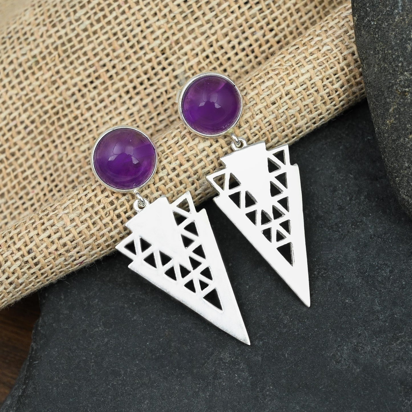 Elegant and beautifully crafted silver designer dangling earrings with round shaped 10mm amethyst gemstone on the earlobe