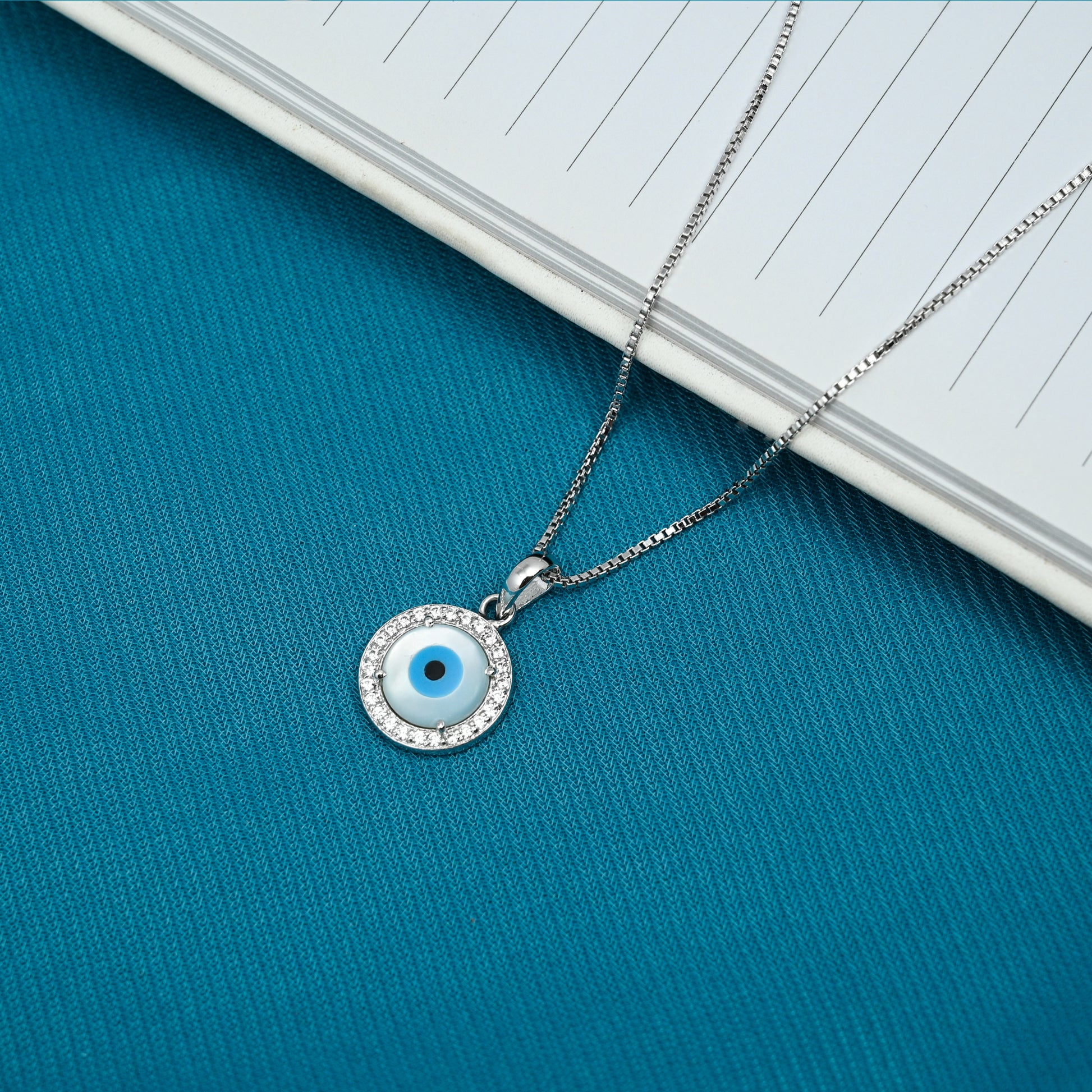 Sterling Silver Pendant Featuring a Round Evil Eye and CZ Clusters